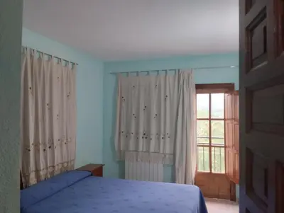 Cama o camas de una habitación en Apartamentos Condado de Miranda