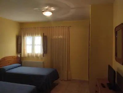 Cama o camas de una habitación en Apartamentos Condado de Miranda
