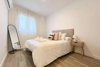 Cama o camas de una habitación en Apartamentos Gredos 002