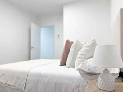 Cama o camas de una habitación en Apartamentos Gredos 002