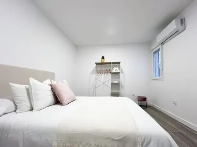 Cama o camas de una habitación en Apartamentos Gredos 002