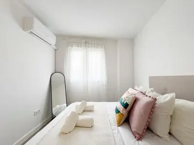 Cama o camas de una habitación en Apartamentos Gredos 002