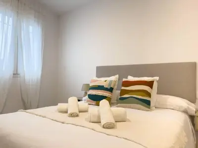 Cama o camas de una habitación en Apartamentos Gredos 104