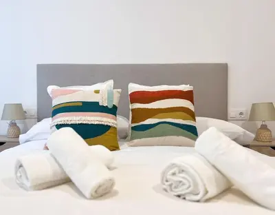 Cama o camas de una habitación en Apartamentos Gredos 104