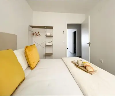 Cama o camas de una habitación en Apartamentos Gredos 104