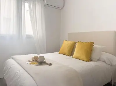 Cama o camas de una habitación en Apartamentos Gredos 104