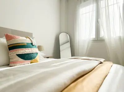 Cama o camas de una habitación en Apartamentos Gredos 304