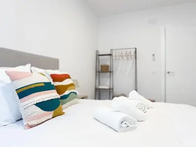 Cama o camas de una habitación en Apartamentos Gredos 304