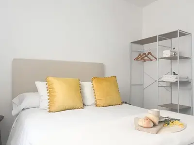 Cama o camas de una habitación en Apartamentos Gredos 304