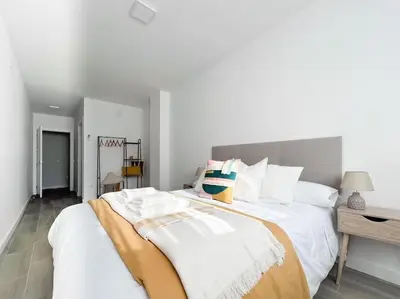 Cama o camas de una habitación en Apartamentos Gredos 301