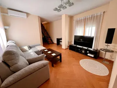 Una televisión o centro de entretenimiento en APARTAMENTOS TURíSTICOS MONTASOL 2