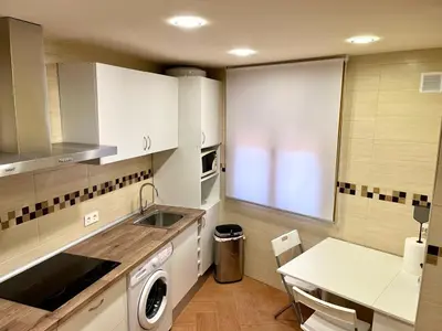 Una cocina o zona de cocina en APARTAMENTOS TURíSTICOS MONTASOL 2