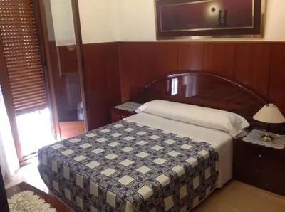 Cama o camas de una habitación en Pension Estefania