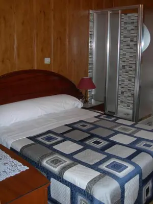 Cama o camas de una habitación en Pension Estefania