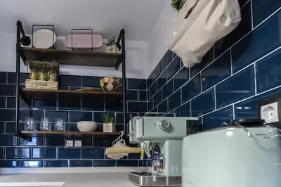 Un baño de U LAGARTU