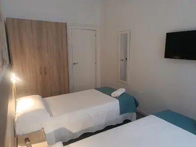 Cama o camas de una habitación en ApartamentosTuristicos Avila Puerta del Alcazar 0-1