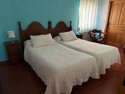 Cama o camas de una habitación en La casa barata, casa rural
