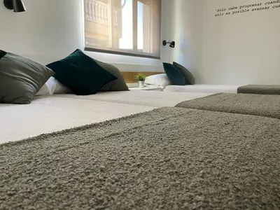 Cama o camas de una habitación en La Antigua Editorial