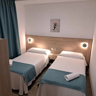 Cama o camas de una habitación en Apartamentos turisticos Ávila Puerta del Carmen 0-3