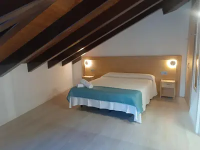 Cama o camas de una habitación en Apartamentos turisticos Ávila Puerta del Mariscal 1-1