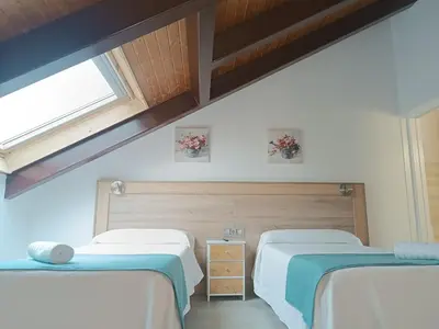 Cama o camas de una habitación en Apartamentos turisticos Ávila Puerta de Los Leales 1-2