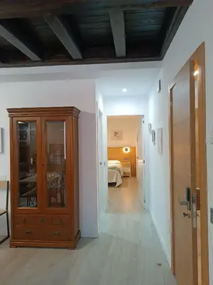 Cama o camas de una habitación en Apartamentos turisticos Ávila Puerta del Puente 1-3
