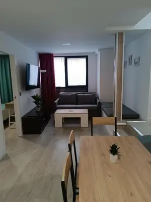 Una televisión o centro de entretenimiento en Apartamentos turisticos Ávila Puerta de San Isidro 1-4