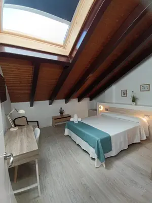 Cama o camas de una habitación en Apartamentos turisticos Ávila Puerta del Rastro 2-2