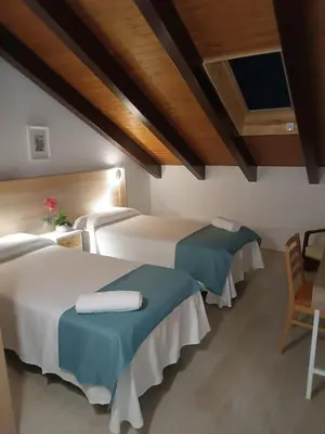 Cama o camas de una habitación en Apartamentos turisticos Ávila Puerta del Rastro 2-2