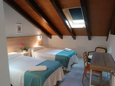 Cama o camas de una habitación en Apartamentos turisticos Ávila Puerta del Rastro 2-2