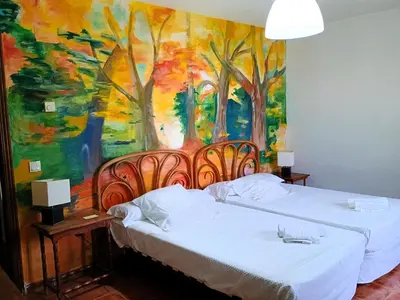 Cama o camas de una habitación en Hotel rural El Jardin del Conde