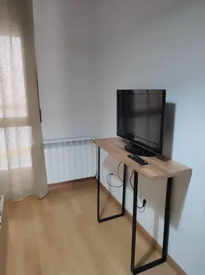 Una televisión o centro de entretenimiento en Casa Tatas Precioso piso recién reformado