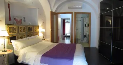 Cama o camas de una habitación en Apartamentos La Machacona Plaza de Santiago