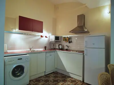Una cocina o zona de cocina en Apartamentos La Machacona Plaza de Santiago