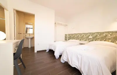 Cama o camas de una habitación en Hostería La milla Rural