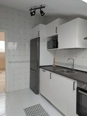 Una cocina o zona de cocina en Ático San Juan 2
