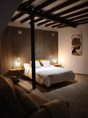 Cama o camas de una habitación en La Fortaleza Apartamentos Rurales