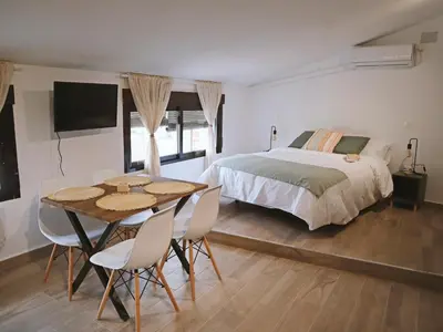 Cama o camas de una habitación en La Fortaleza Apartamentos Rurales
