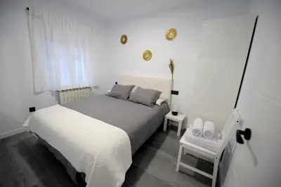 Cama o camas de una habitación en APARTAMENTOS LUDOVICO