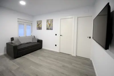 Una televisión o centro de entretenimiento en APARTAMENTOS LUDOVICO