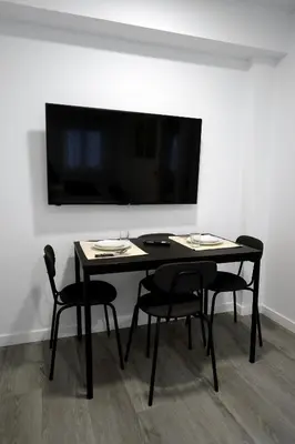 Una televisión o centro de entretenimiento en APARTAMENTOS LUDOVICO