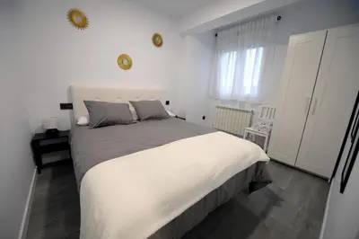 Cama o camas de una habitación en APARTAMENTOS LUDOVICO