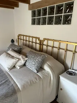 Cama o camas de una habitación en LA GOLONDRINA