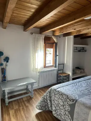 Cama o camas de una habitación en LA GOLONDRINA