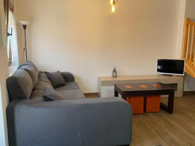 Una televisión o centro de entretenimiento en Casa Capricho