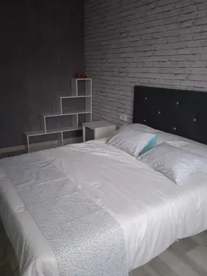 Cama o camas de una habitación en Alojamiento Roma