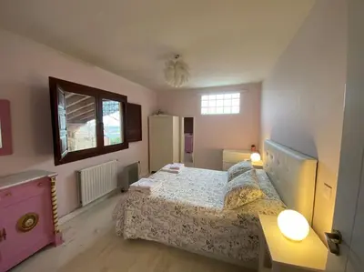 Cama o camas de una habitación en Casa Galatea con jardín junto al pueblo