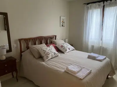 Cama o camas de una habitación en Casa Galatea con jardín junto al pueblo