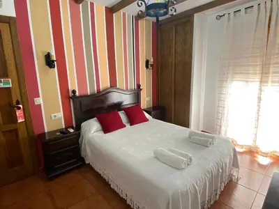 Cama o camas de una habitación en Hostal El Descanso Del Emperador