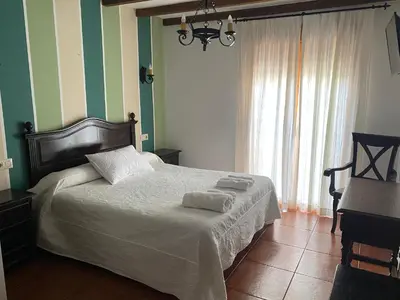 Cama o camas de una habitación en Hostal El Descanso Del Emperador